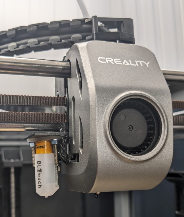 A BLTouch on a Creality K1 Max, with fan shroud