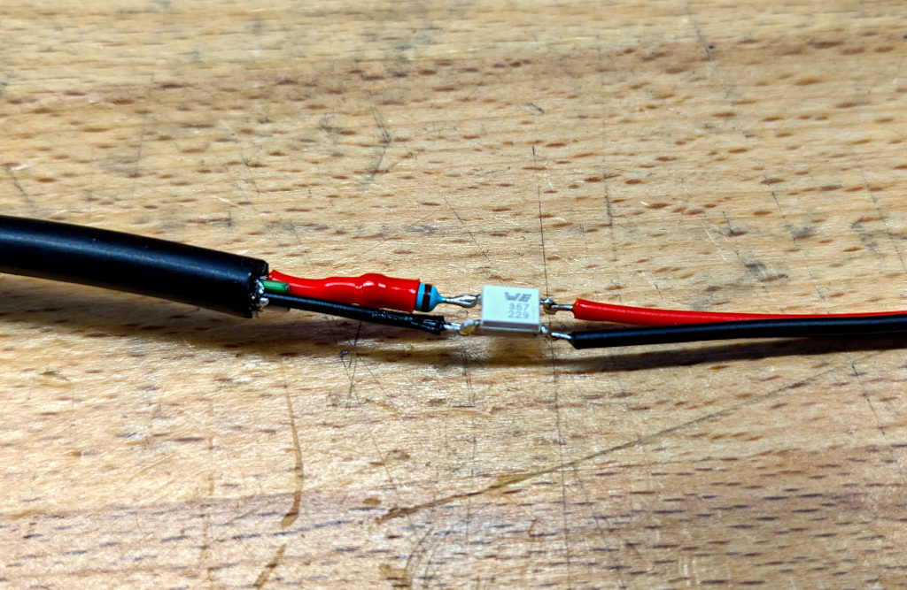 Opto-copler and resistor spliced onto a USB-cable